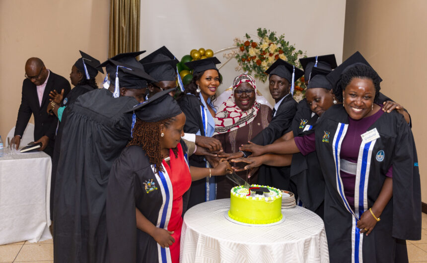 Graduates cut cake with commissioner Inspiring the Palliative Care Leaders of Tomorrow